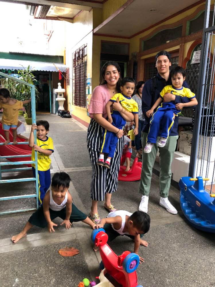 Foundation family members with children at a partner shelter